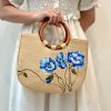 Handmade Woven Straw Bag Adorned With Floral Patterns