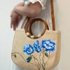 Handmade Woven Straw Bag Adorned With Floral Patterns